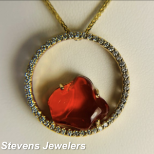 Sid Stevens Jewelers Albany Oregon Organic Red Stone in Circular Gold Pendant